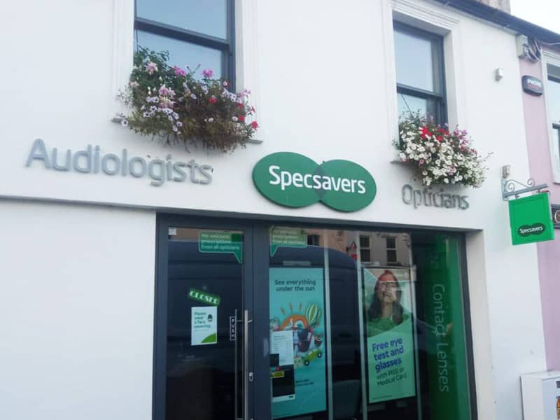 flowers in hanging baskets outside retail unit